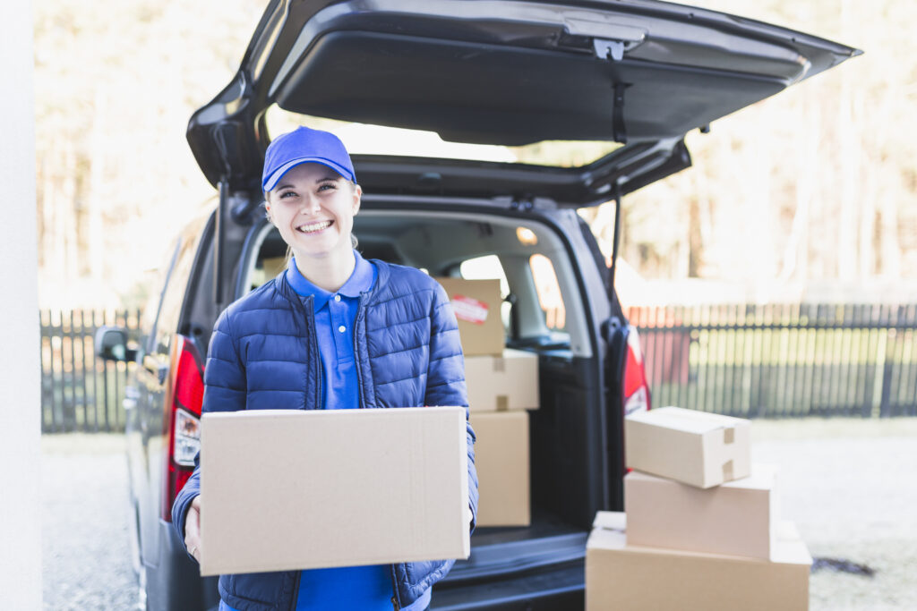 cheerful-girl-with-carton-boxes-1024x683